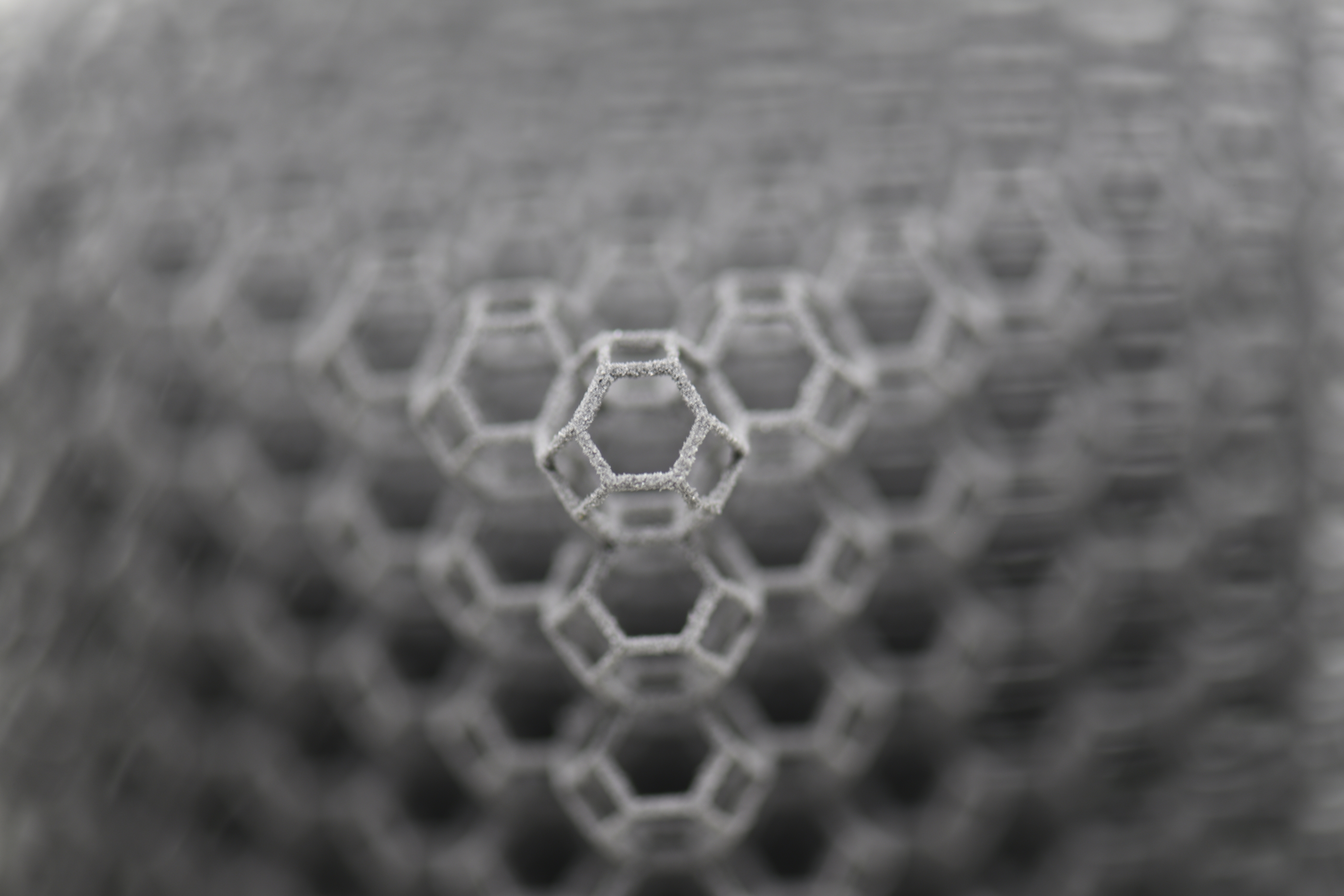 Predicting the unpredictable: generative design of truss metamaterials beyond boundaries