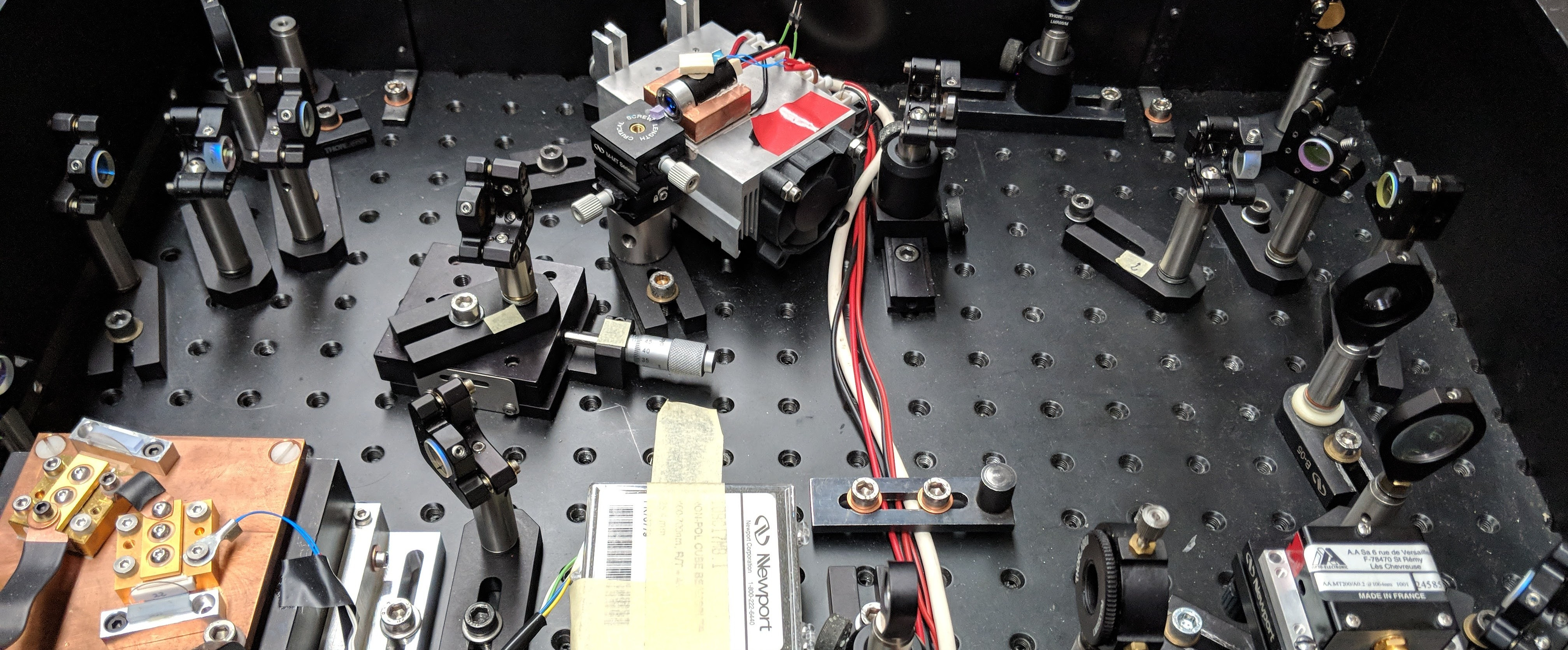 Ultrafast laser pulses to study hybrid magnetic resonances