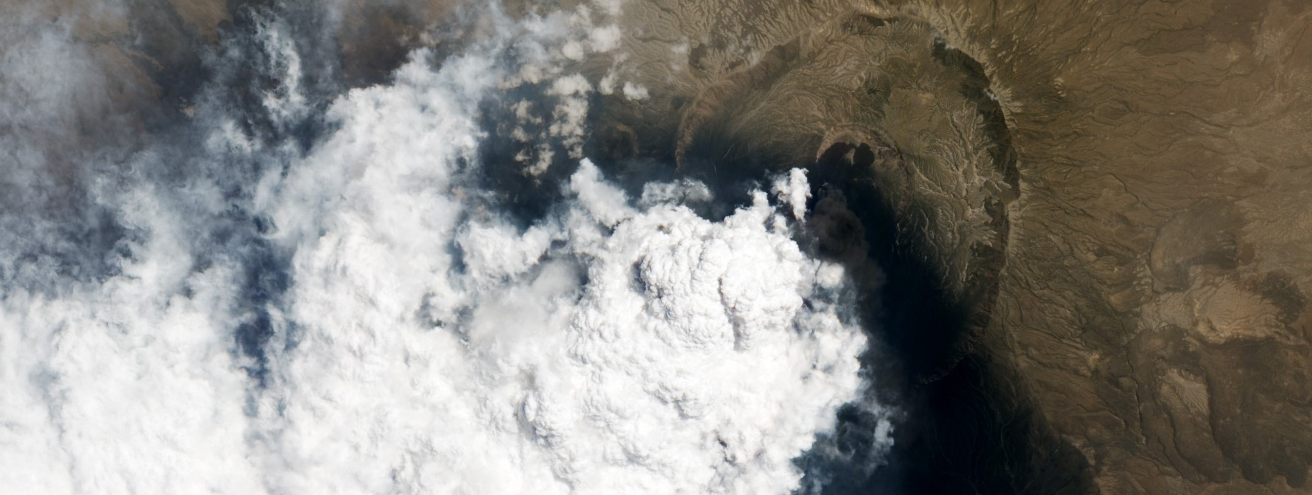 The influence of the Asian summer monsoon on volcanic aerosol transport in the UTLS region